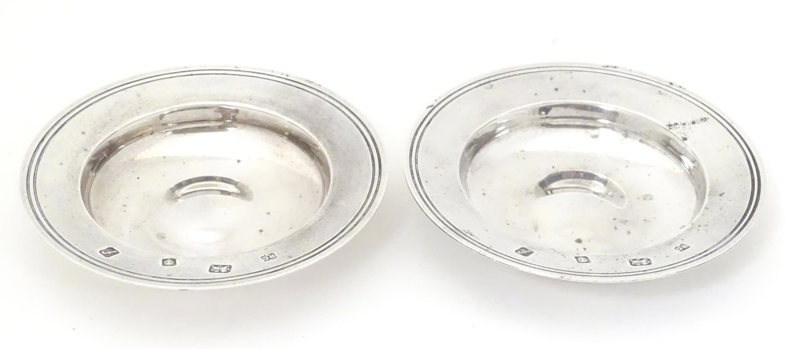 A pair of silver dishes modelled as miniature Armada: A pair of silver dishes modelled as miniature Armada dishes, hallmarked London 1961, Richard Comyns. Approx. 4 1/4" diameter (2)