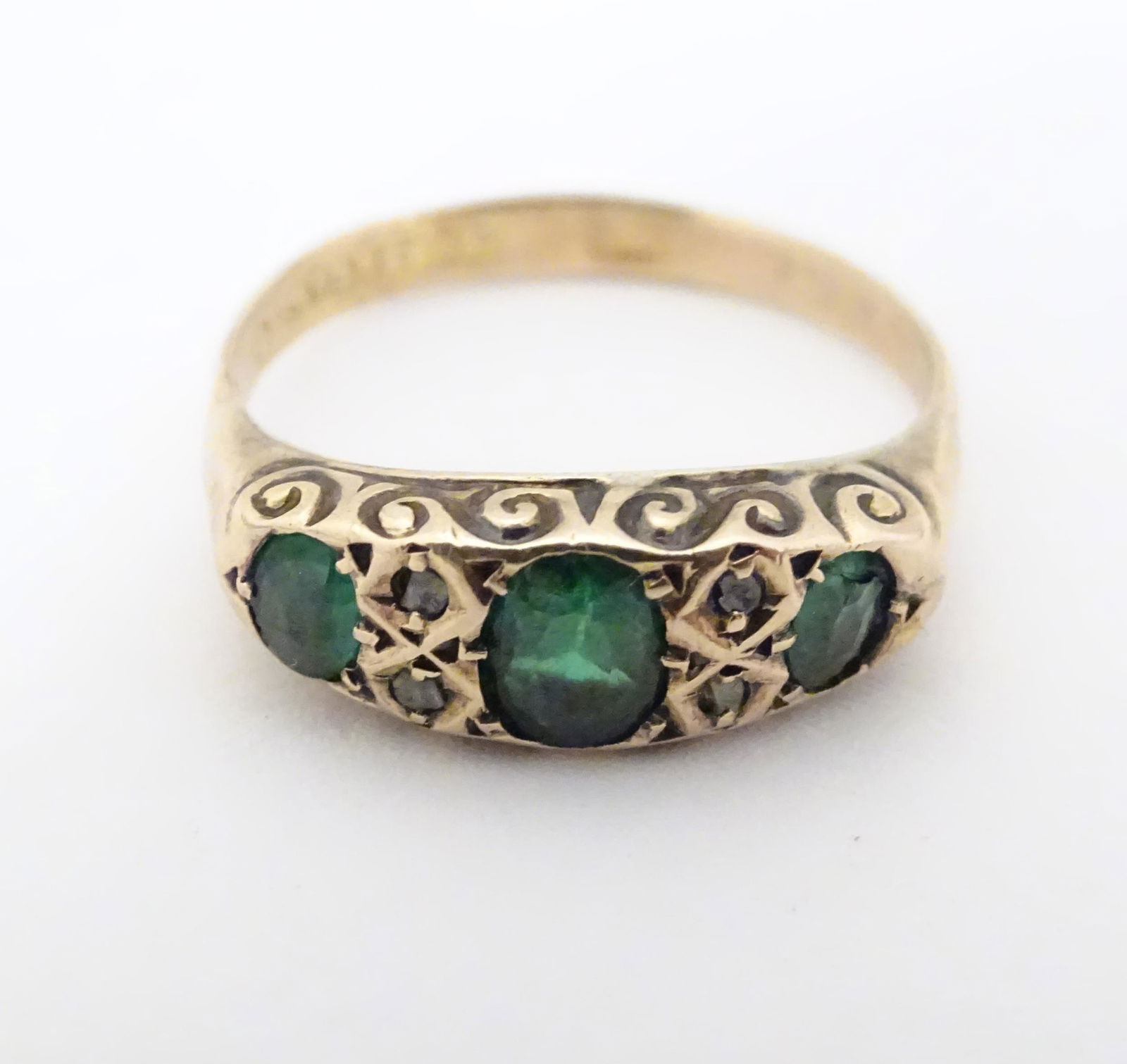An early 20thC 9ct gold ring set with three green (1 of 6)