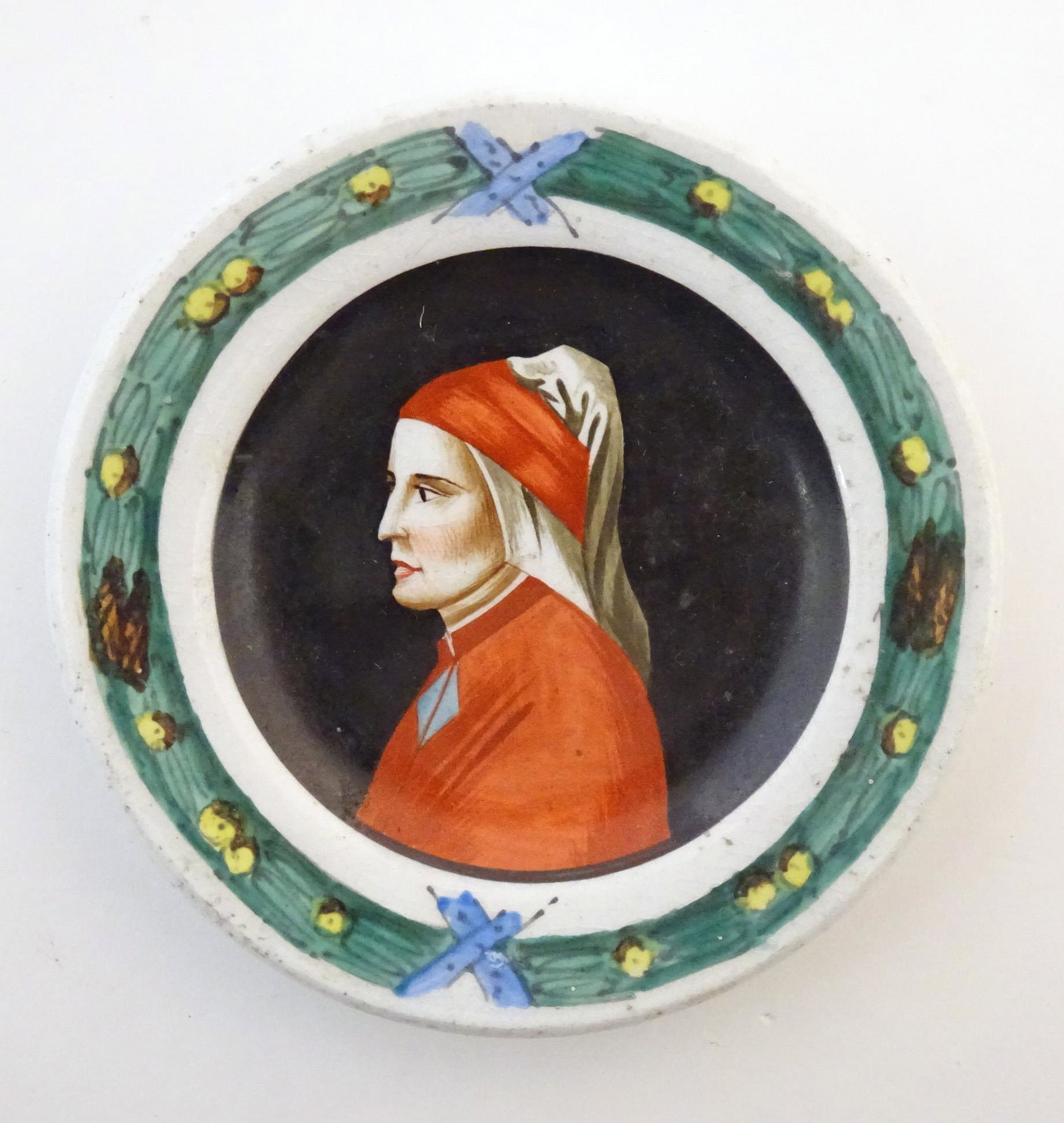 A small Italian dish of circular form depicting a (1 of 4)