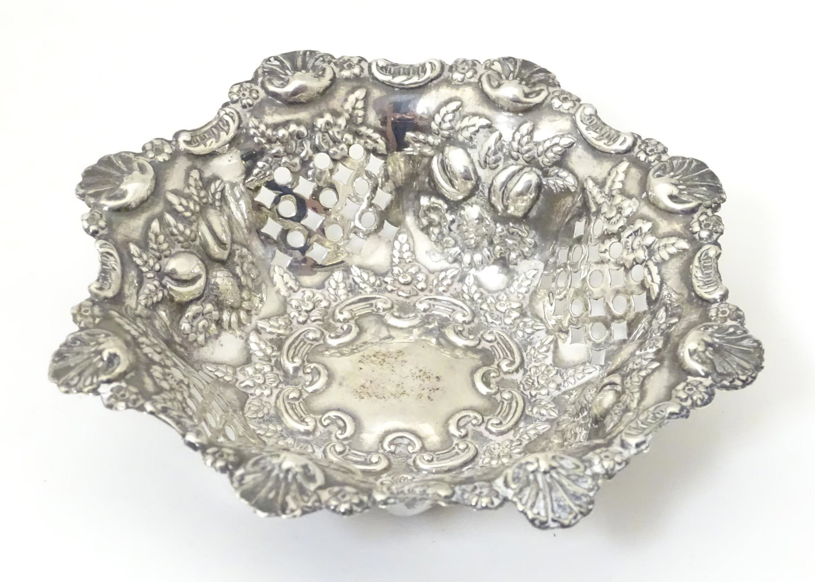 A silver pin dish with pierced and embossed decoration. (1 of 8)
