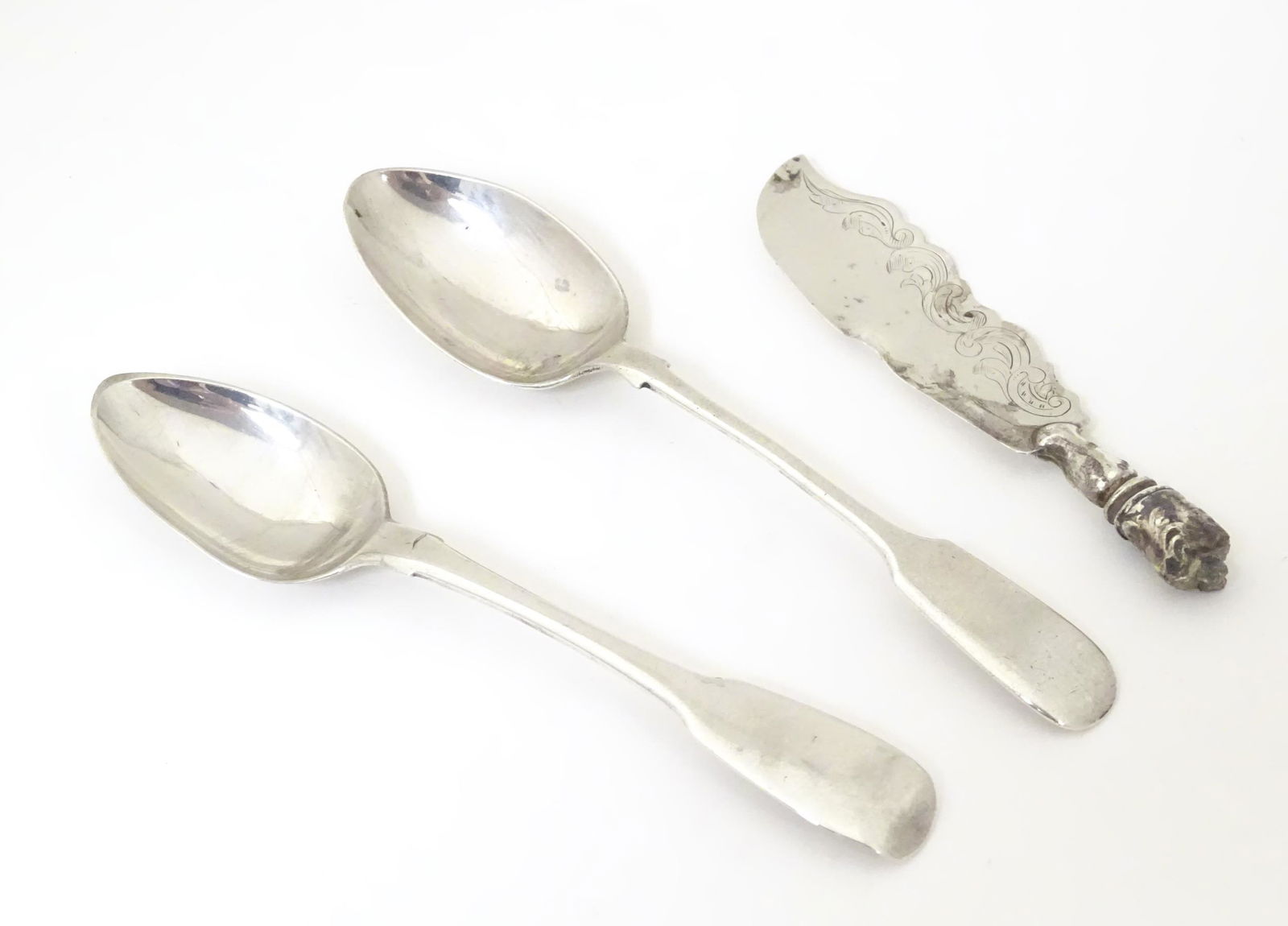 A George III fiddle pattern teaspoon, hallmarked London: A George III fiddle pattern teaspoon, hallmarked London 1815, maker Sarah & John William Blake. Together with a Victorian silver fiddle pattern teaspoon, hallmarked Sheffield 1883, maker John Edward B