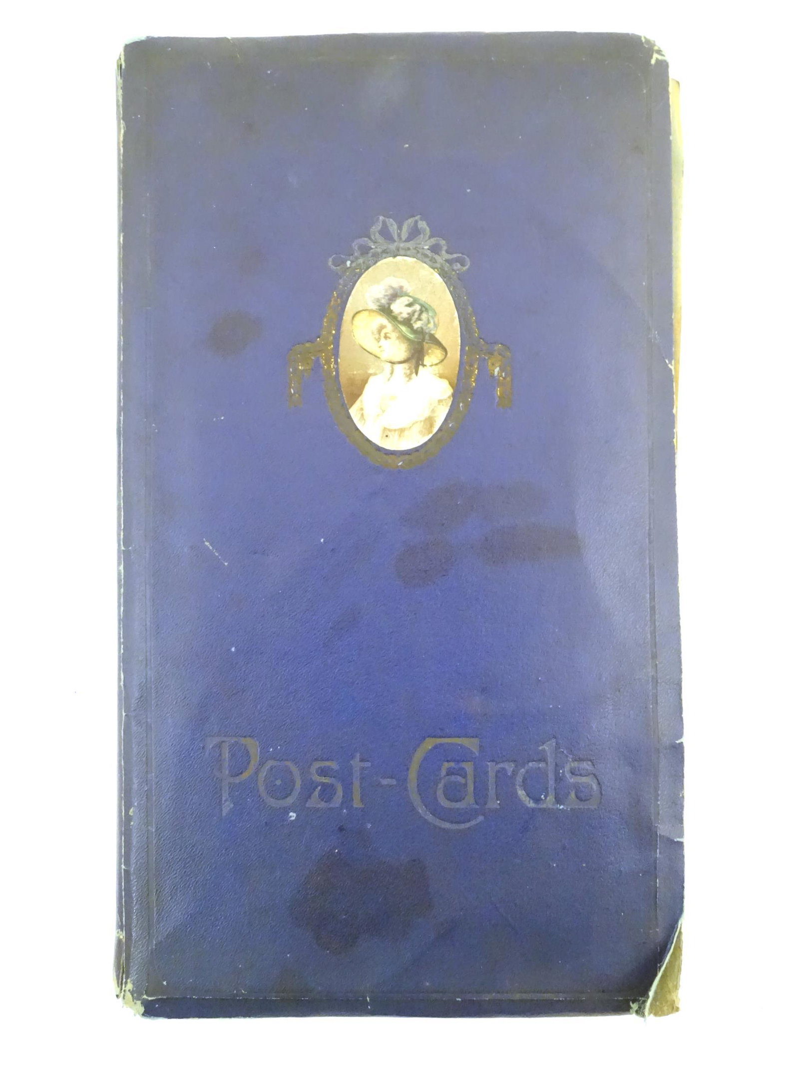 An early 20thC postcard album containing a variety of (1 of 13)