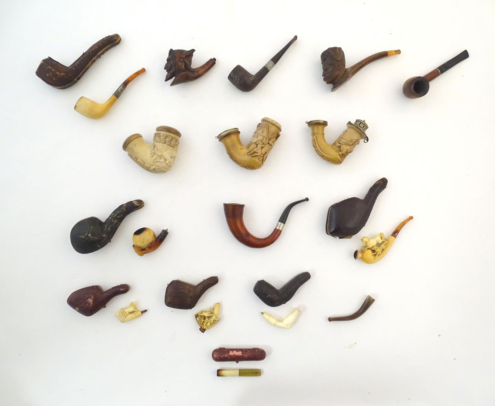 A collection of 19thC and later smoking pipes, (1 of 10)