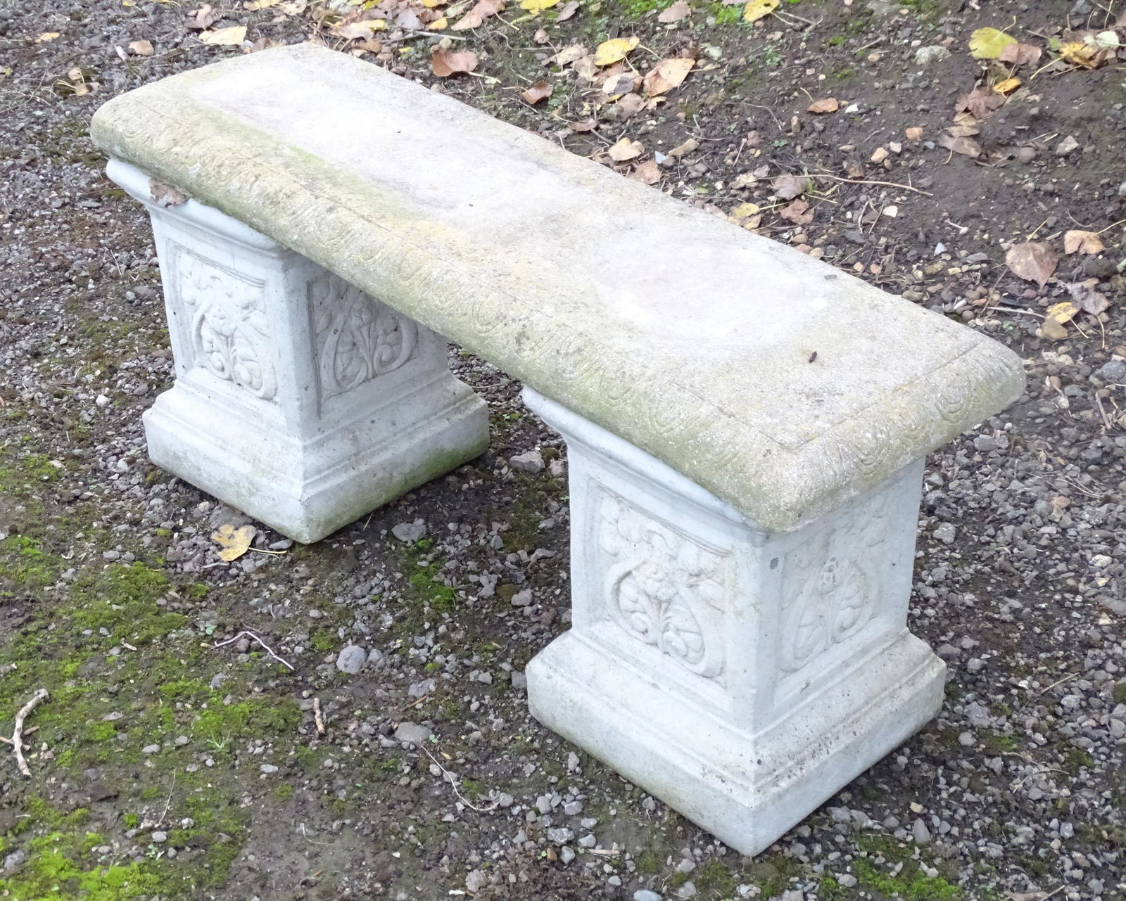 A late 20thC reconstituted stone garden bench,: A late 20thC reconstituted stone garden bench, consisting of two pedestals supporting a rectangular seat, approximately 43" wide