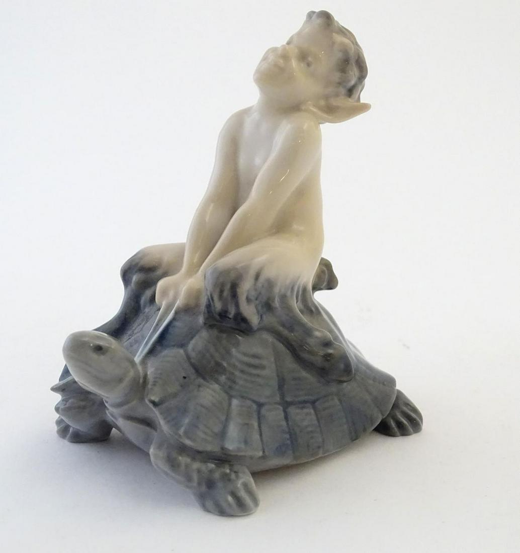 A Royal Copenhagen figure of a faun riding a tortoise, (1 of 6)