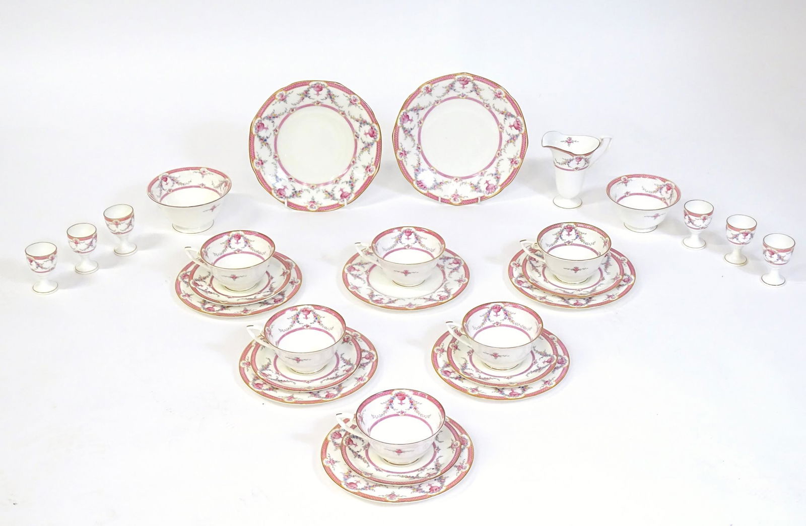 A quantity of Royal Worcester breakfast wares in the: A quantity of Royal Worcester breakfast wares in the pattern Rosemary to include tea cups, saucers, egg cups, milk jug, sugar bowl, cake plate, side plates, etc. Marked under. Jug approx. 5" high (29)
