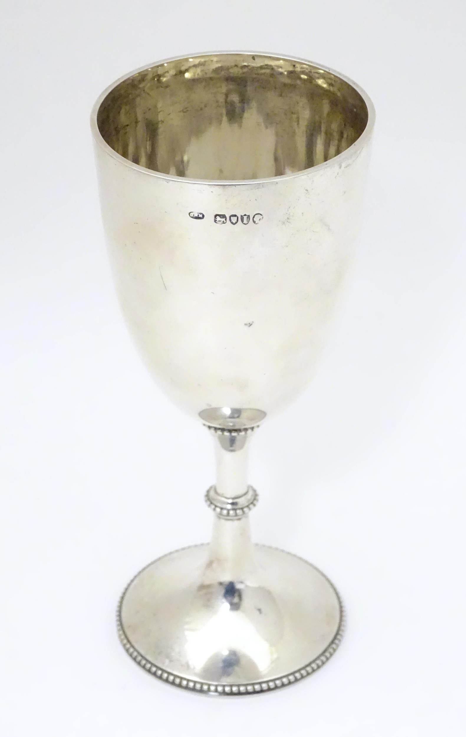 A Victorian silver cup of goblet form. Hallmarked (1 of 7)