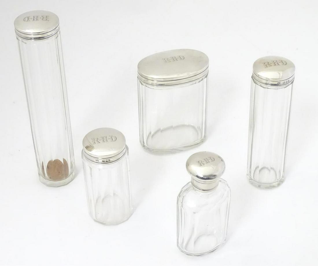A collection of five silver lidded glass dressing table (1 of 9)