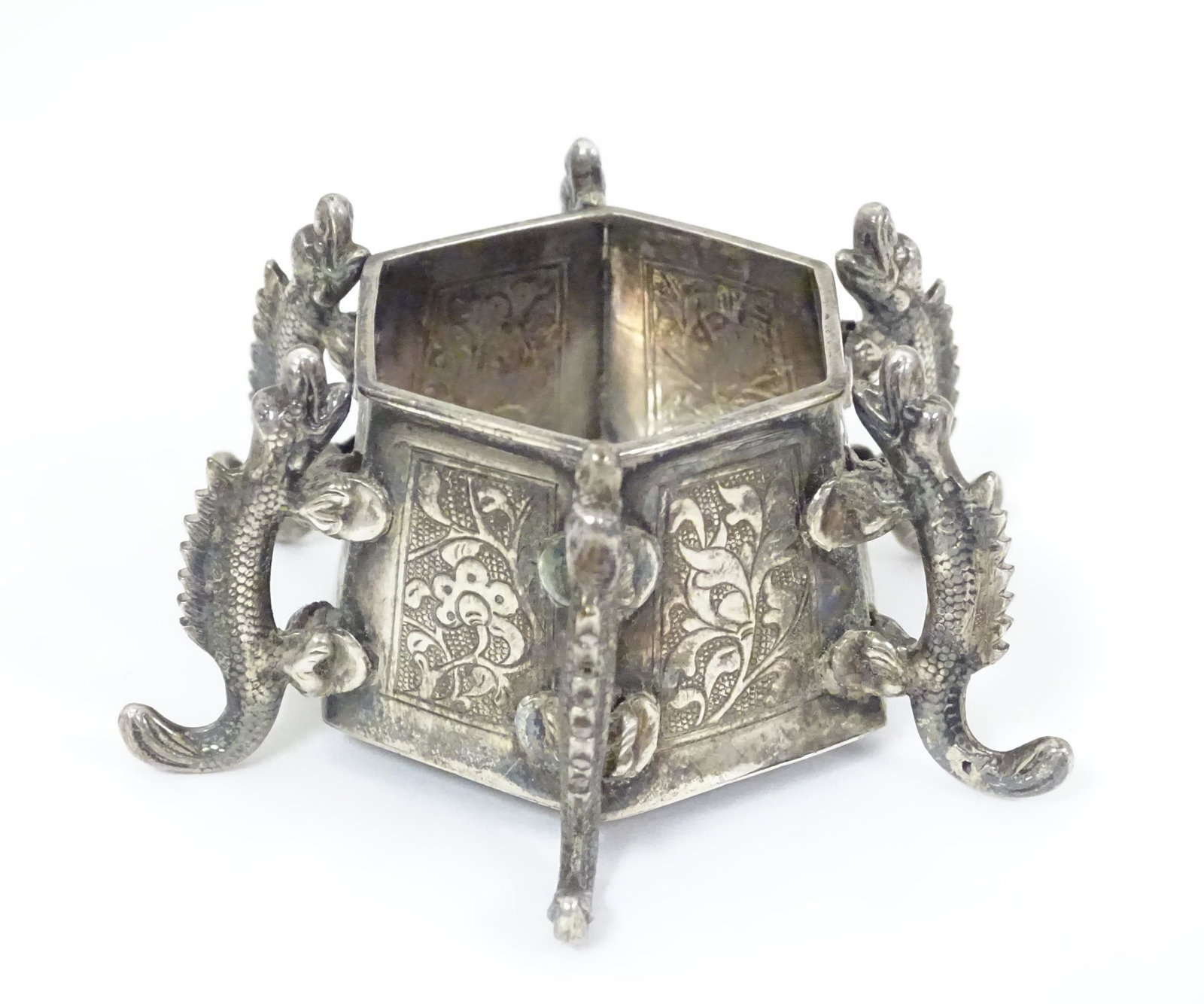 Chinese Export : A white metal hexagonal formed small: Chinese Export : A white metal hexagonal formed small pot / salt with dragon decoration and marked under with oriental character marks. Approx. 2 1/2" wide
