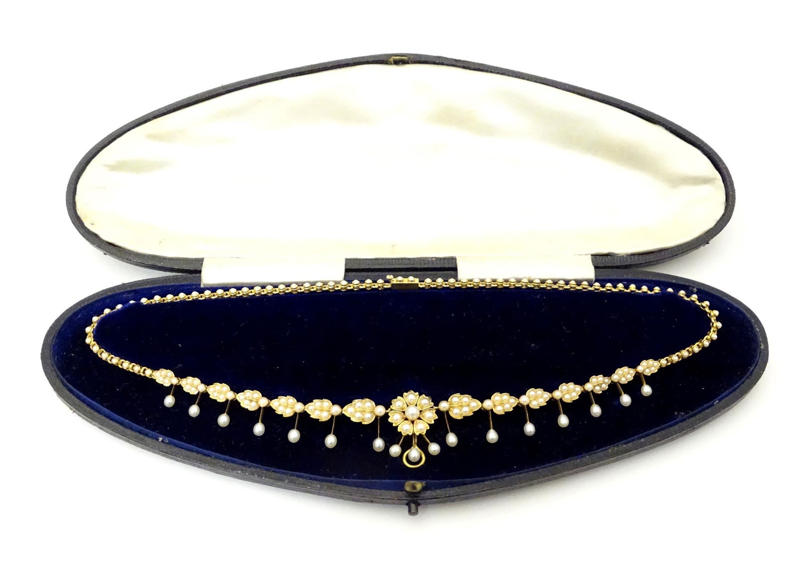 An Edwardian yellow metal necklace set with a profusion (1 of 13)