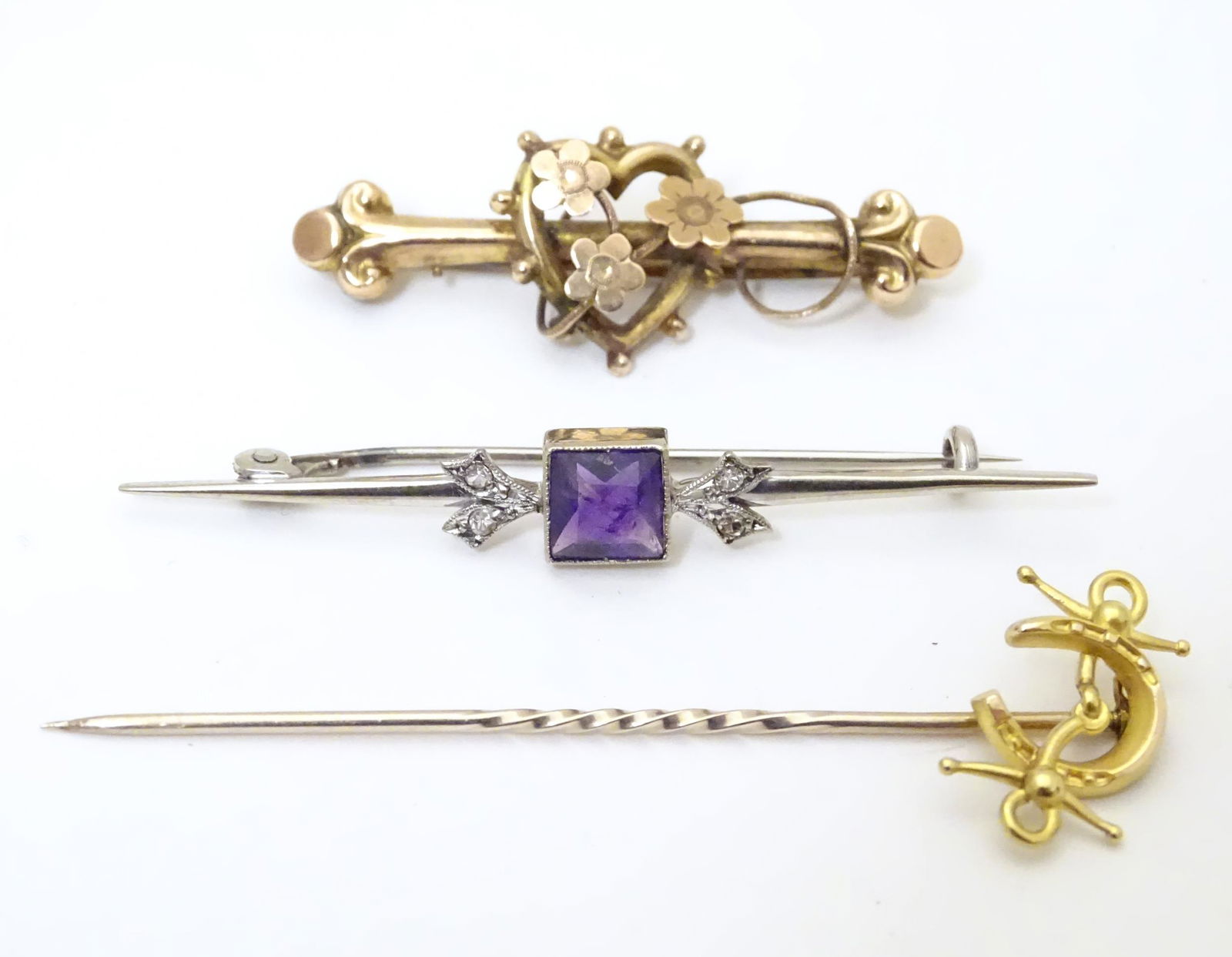 Three assorted brooches to include a 9ct white gold bar (1 of 11)