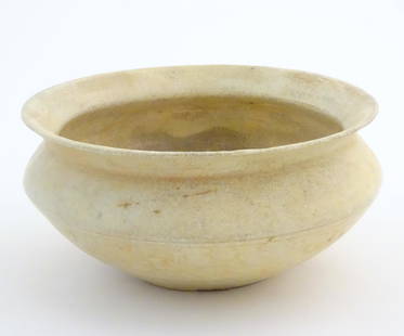 A Chinese bowl of squat form with a flared rim, decorated with floral and foliate decoration in: A Chinese bowl of squat form with a flared rim, decorated with floral and foliate decoration in relief. Approx. 4" high x 8 1/4" diameter