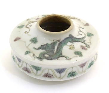 A Chinese brush wash of circular form decorated with dragons amongst stylised clouds. Character: A Chinese brush wash of circular form decorated with dragons amongst stylised clouds. Character marks under. Approx. 2" high x 4 1/4" wide