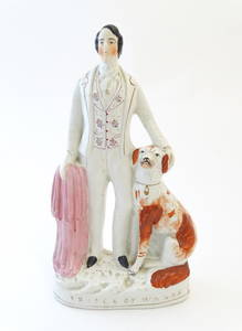 A large Victorian Staffordshire pottery flat back figure depicting the Prince of Wales with a