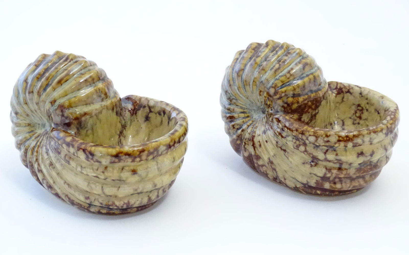 A pair of 20thC large ceramic table salts modelled as shells. Approx. 3 3/4" high x 5 1/4" wide x 3: A pair of 20thC large ceramic table salts modelled as shells. Approx. 3 3/4" high x 5 1/4" wide x 3 1/2" deep (2)