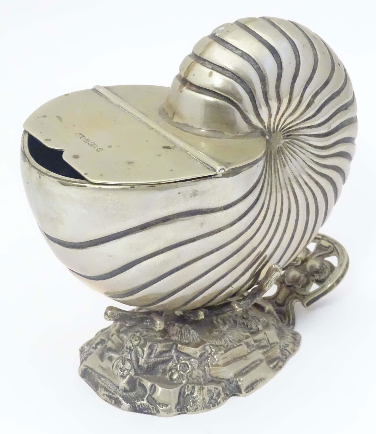 A late 19thC / early 20thC silver plate spoon warmer formed as a nautilus shell. Approx 6 1/2" high (1 of 8)