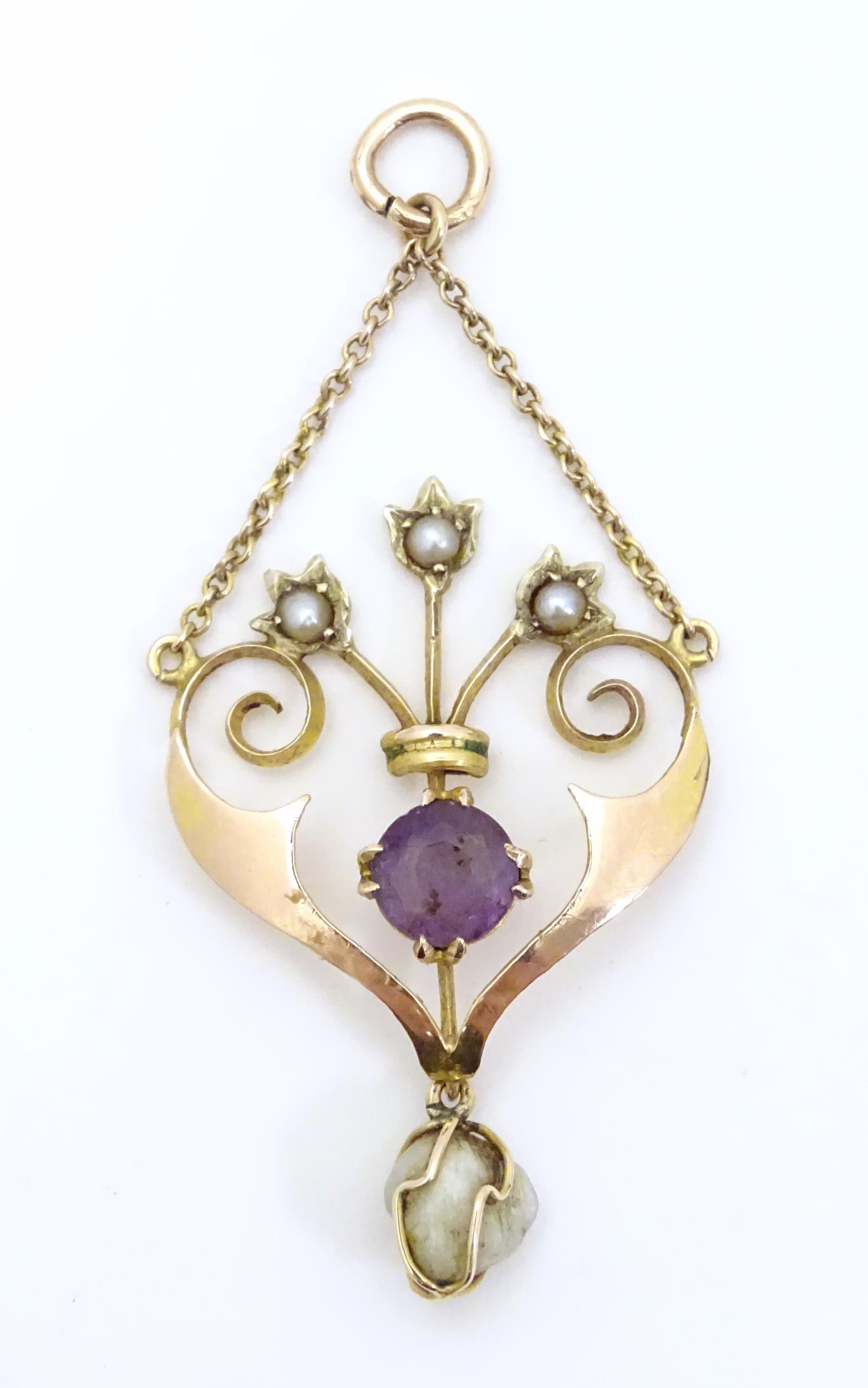 An Art Nouveau 9ct gold pendant set with amethyst and pearls. Appox 2" long (1 of 7)