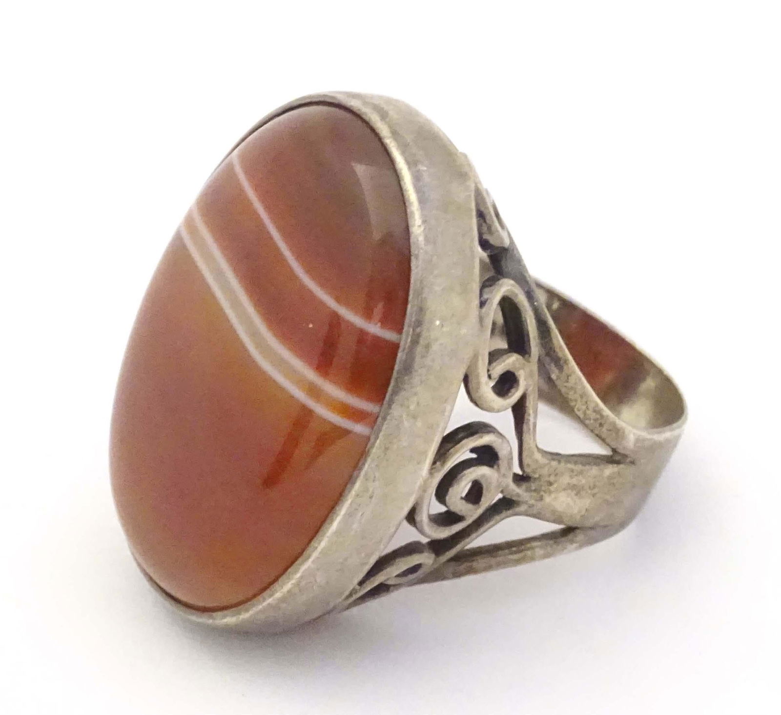 A silver dress ring set with agate cabochon. Hallmarked London 1974 maker GP: A silver dress ring set with agate cabochon. Hallmarked London 1974 maker GP