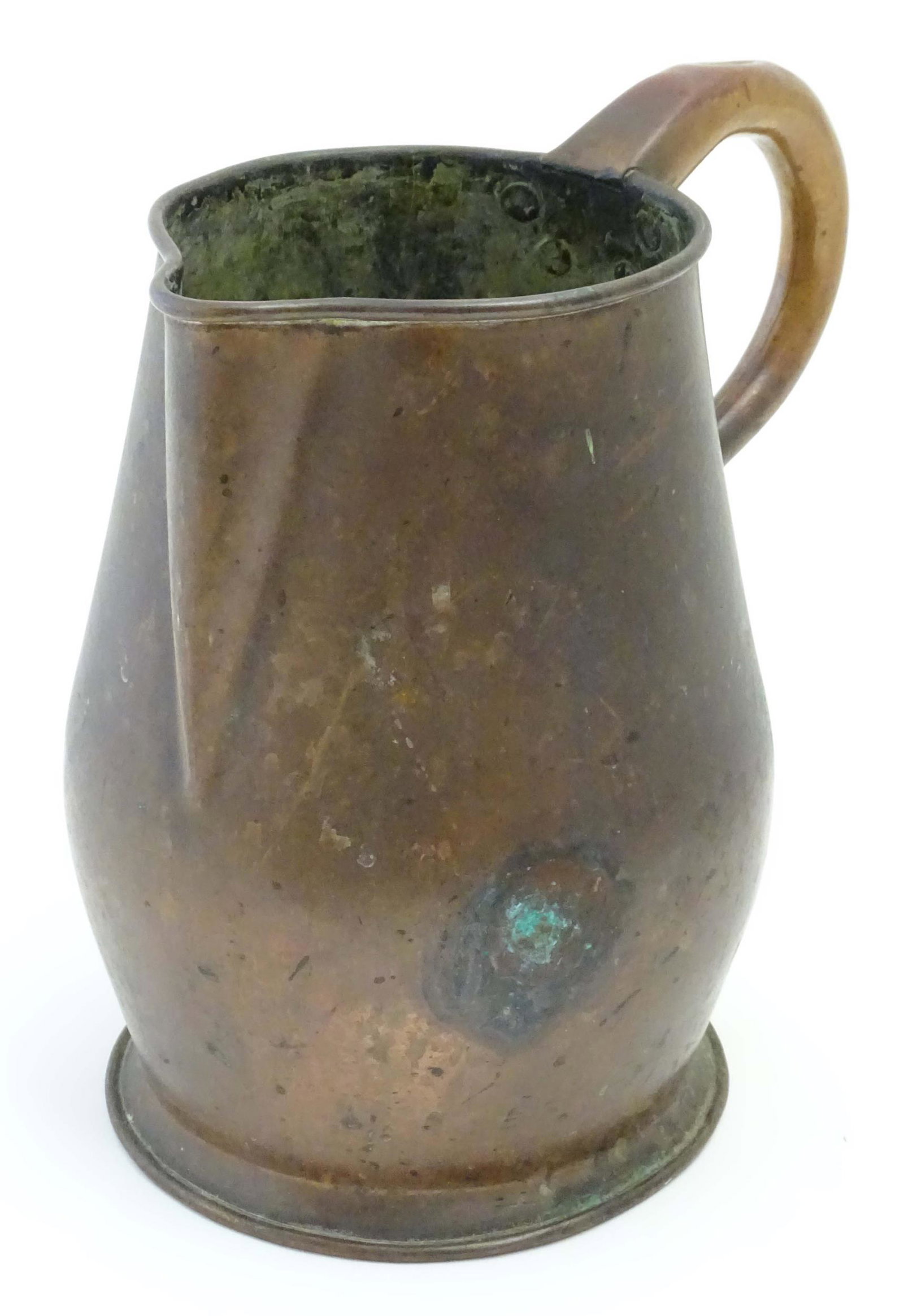An old copper jug with spout and loop handle. Approx. 9 3/4" high: An old copper jug with spout and loop handle. Approx. 9 3/4" high