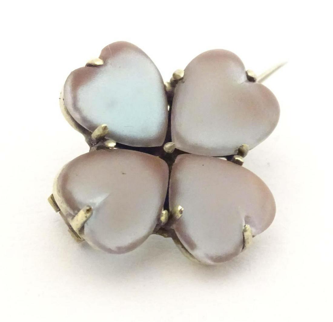 A brooch for four leaf clover form set with four heart shaped saphiret glass cabochon. 3/4" wide (1 of 6)