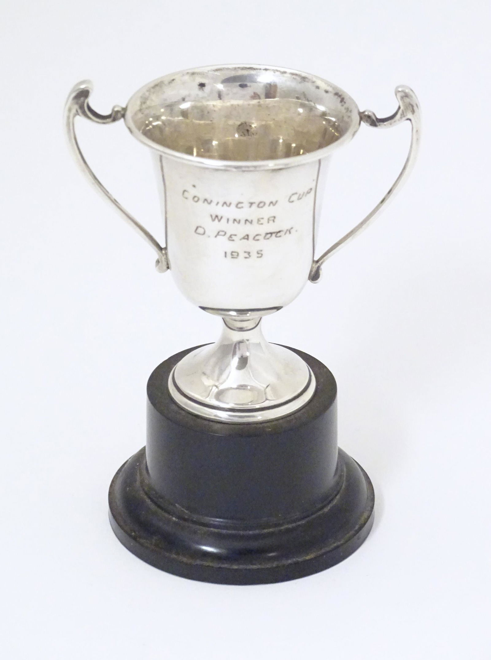 An Art Deco miniature silver twin handled trophy cup with socle base, hallmarked London 1937, maker (1 of 6)