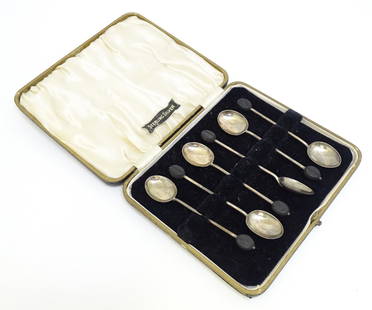 A cased set of six silver coffee spoons the handles surmounted by coffee beans, hallmarked: A cased set of six silver coffee spoons the handles surmounted by coffee beans, hallmarked Birmingham 1924, maker William Suckling Ltd. Approx. 3 3/4" long
