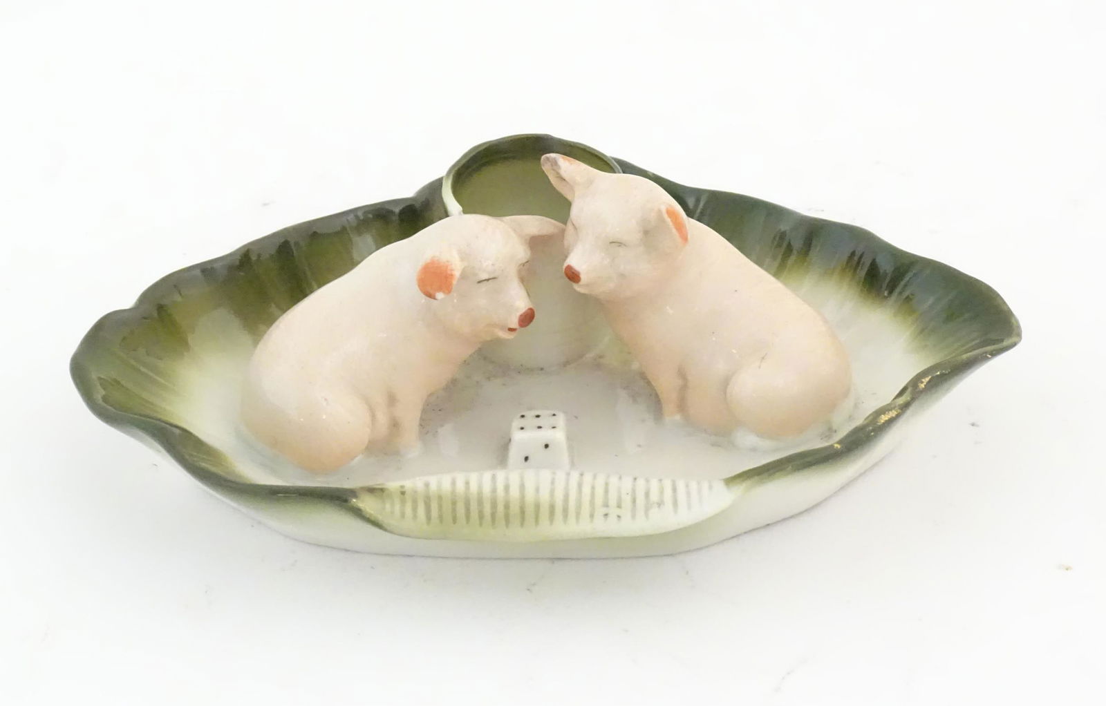 A 20thC German novelty ceramic match keep and striker with two pigs / piglets, a dice / die and a (1 of 7)