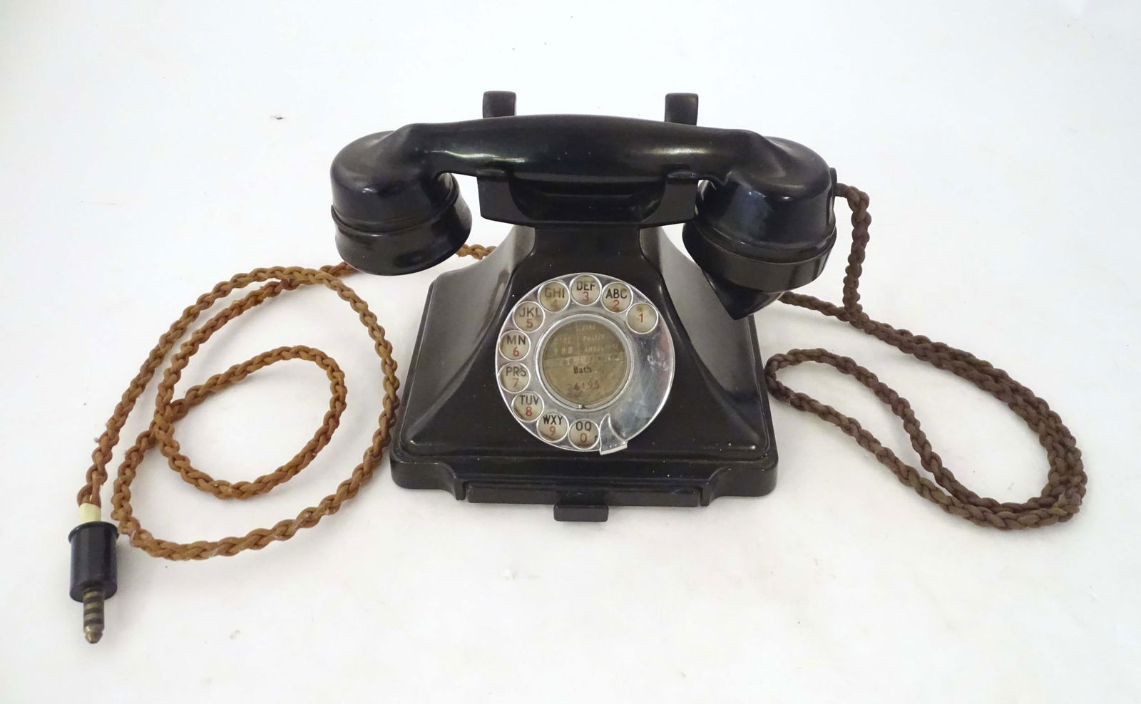 A c1930s GPO 232L telephone, of Bakelite construction with black finish, the receiver stamped 'PL-43: A c1930s GPO 232L telephone, of Bakelite construction with black finish, the receiver stamped 'PL-43 GPO - No. 164.' 7 1/2 wide, 6" high, 5 3/4" deep