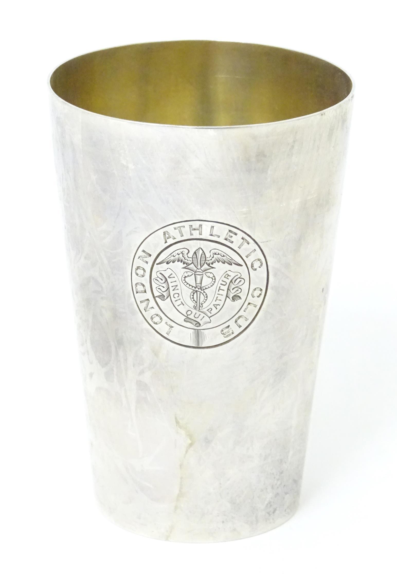 A Victorian silver beaker of tapering form, engraved London Athletic Club, hallmarked London 1899, (1 of 7)