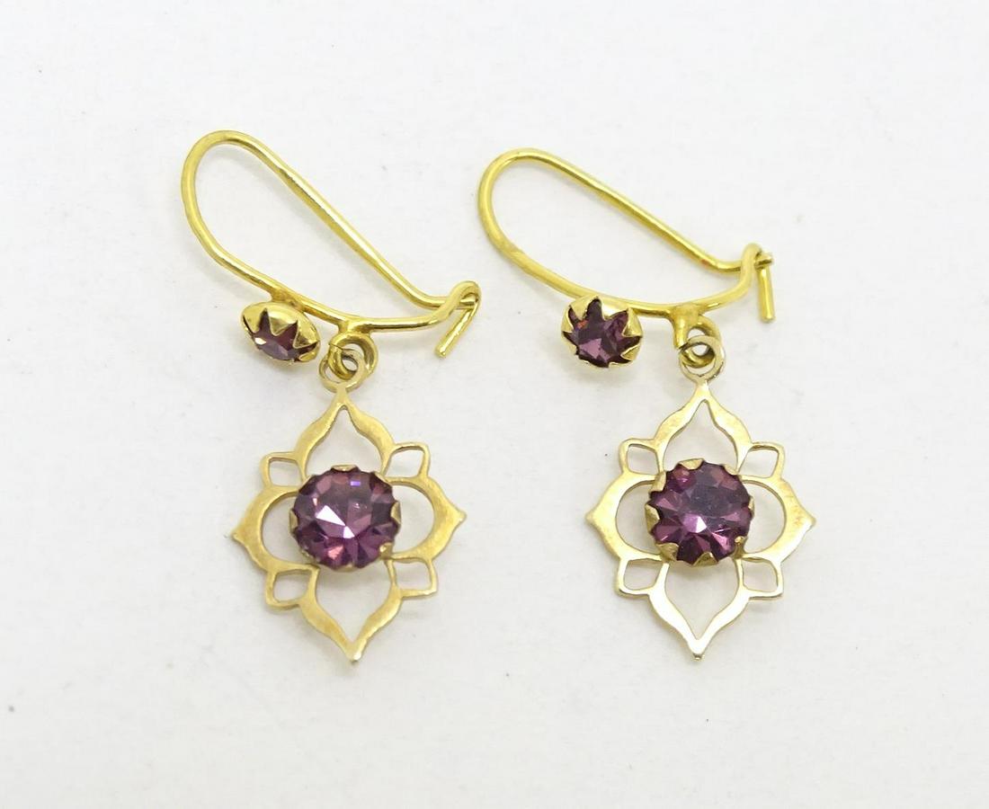 A pair of 9ct gold drop earrings set with purple stones. Approx 3/4" long (1 of 5)