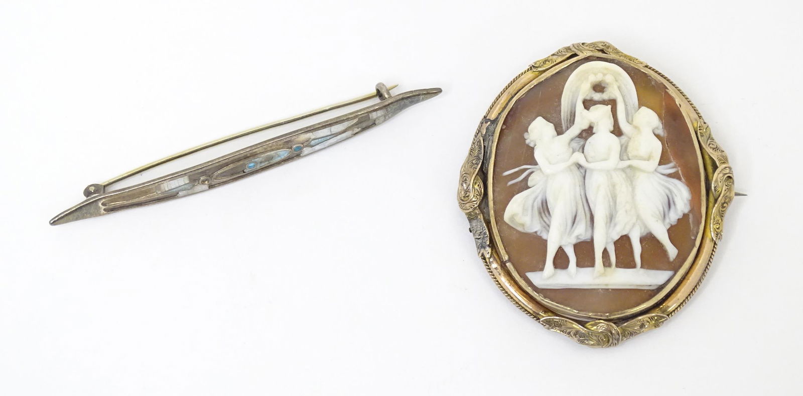 A Victorian cameo brooch depicting the three graces, together with a silver brooch hallmarked: A Victorian cameo brooch depicting the three graces, together with a silver brooch hallmarked Chester 1912 maker Charles Horner. Approx 3" wide (2)
