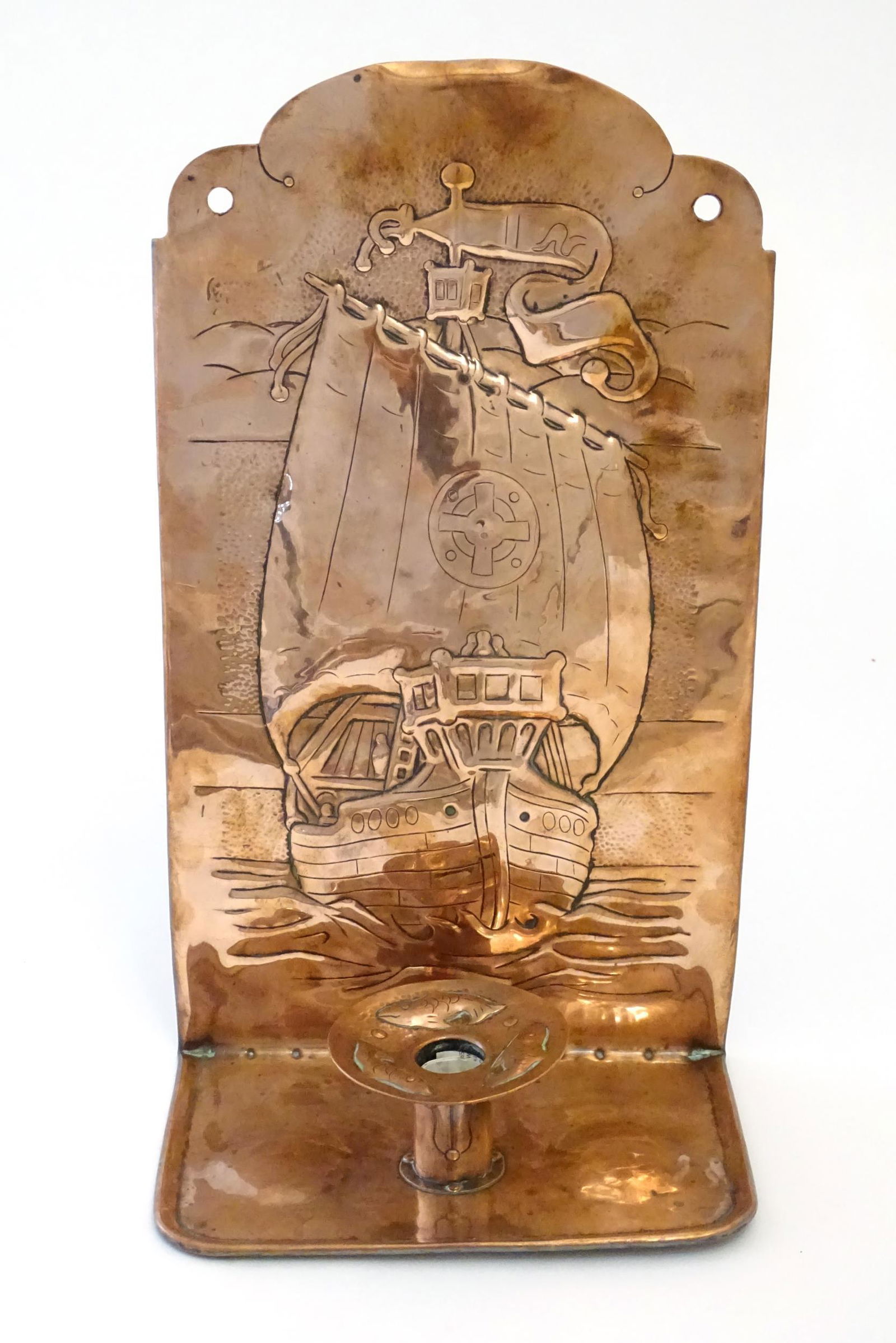 An Arts & Crafts copper wall sconce / candle holder with back reflector decorated with an embossed (1 of 4)