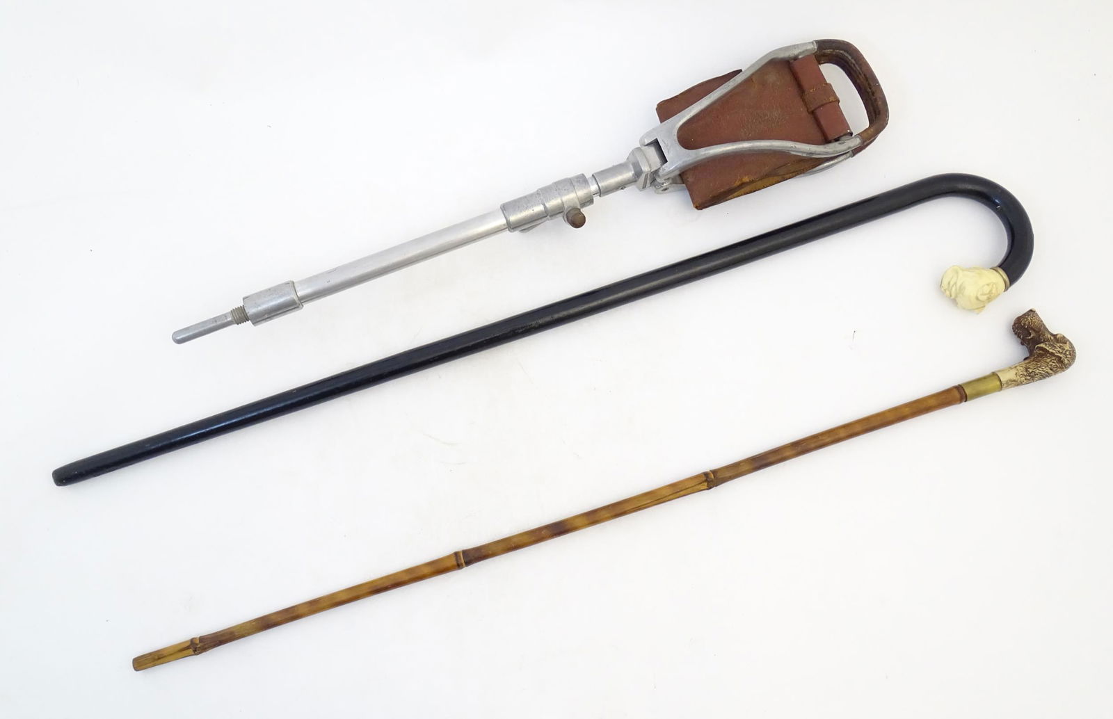 Two 20thC walking sticks / canes comprising an ebonised walking stick the handle modelled as a boxer (1 of 8)