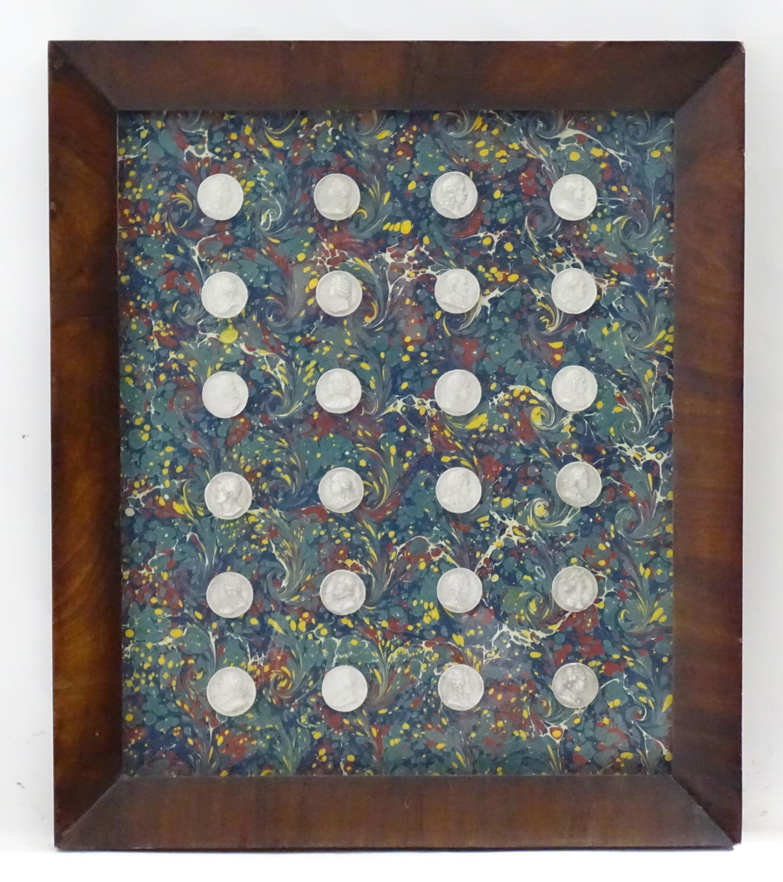 Twenty four Grand Tour style plaster intaglios mounted together on marbled paper. Each depicting a (1 of 3)