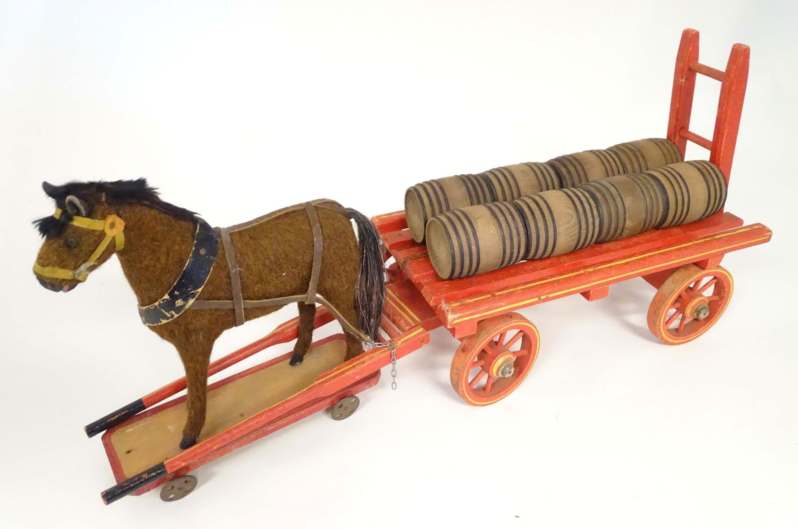 Toy: An early 20thC toy horse and cart / dray with eight barrels. Approx 26 1/2" wide x 7 5/8" deep, (1 of 8)
