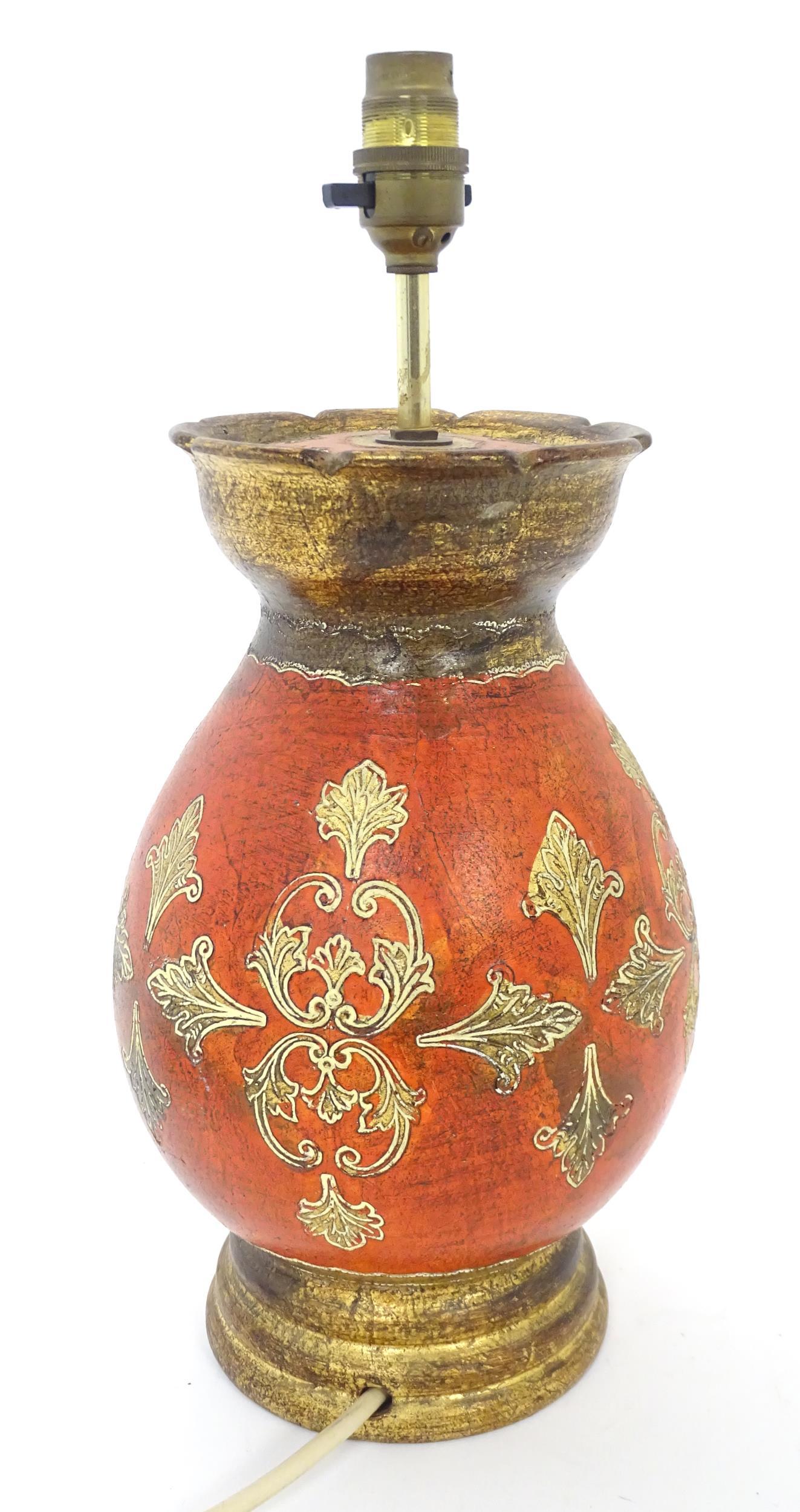 A terracotta table lamp with red, cream and gilt decoration. Approx. 15 1/2" high (1 of 6)