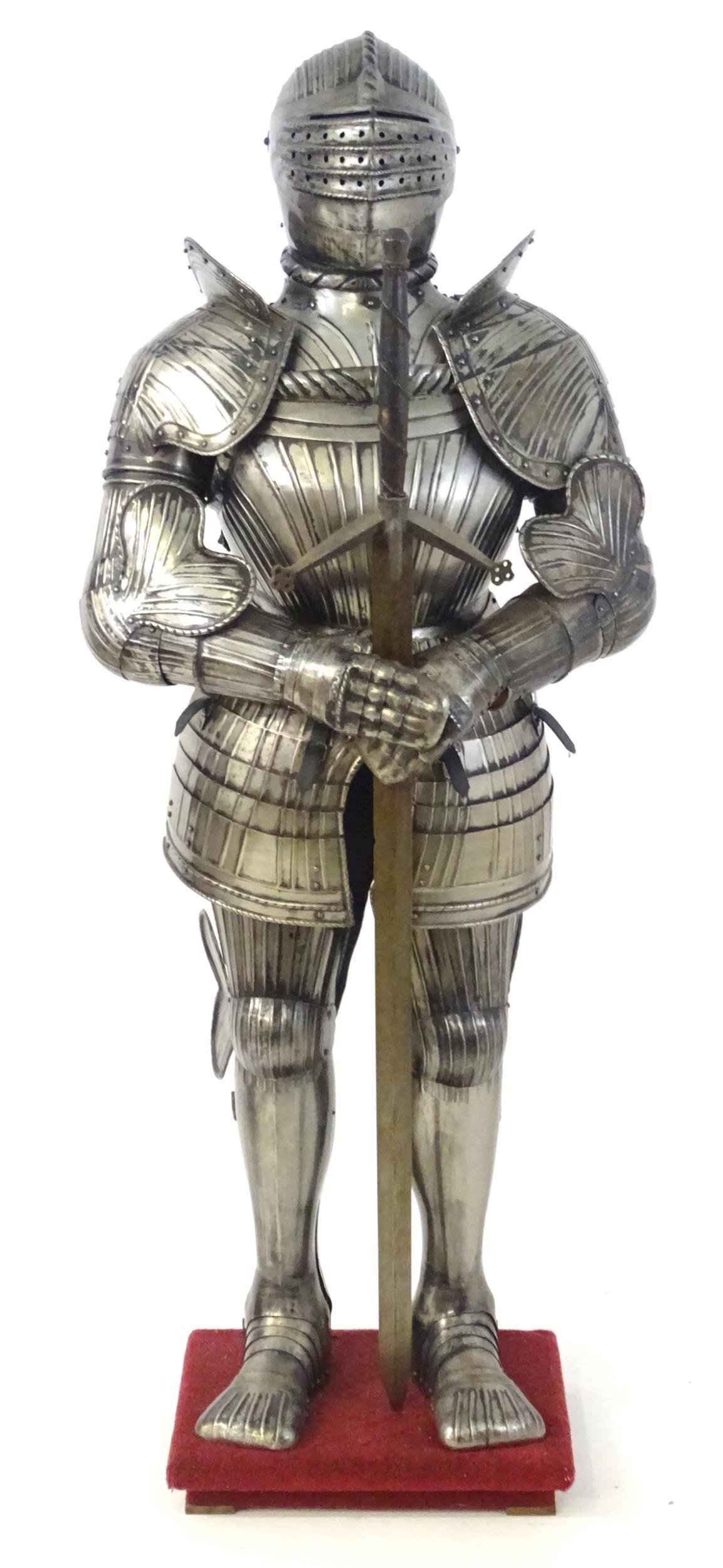 Militaria: a 20thC medieval style display suit of armour, constructed from articulated steel panels (1 of 16)