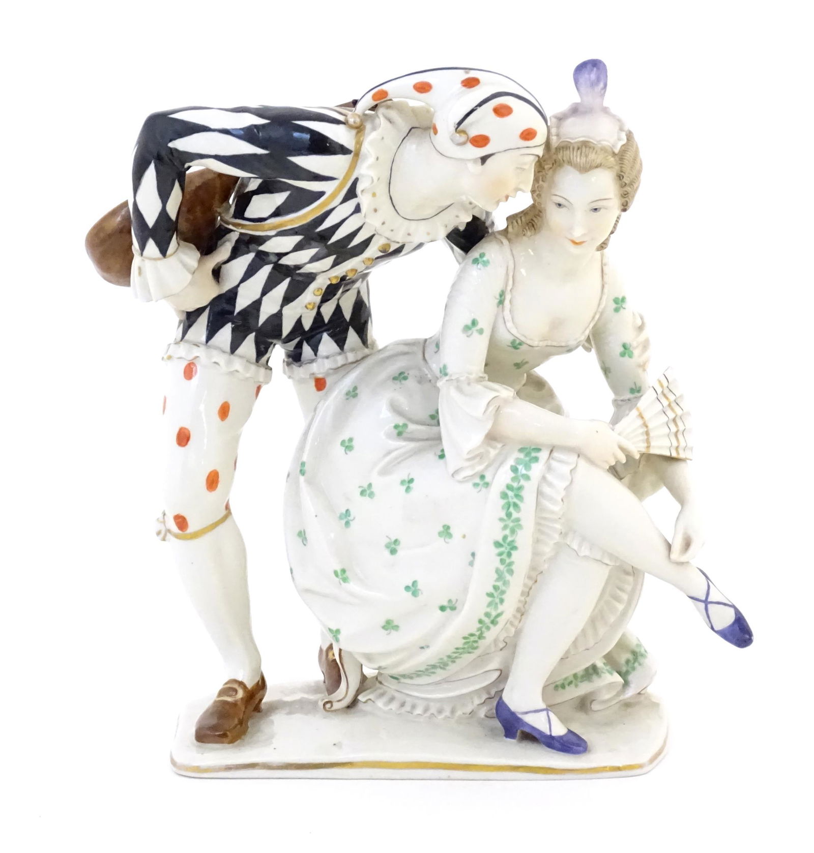 A Continental figural group comprising harlequin / jester with mandolin and a seated lady with a (1 of 6)