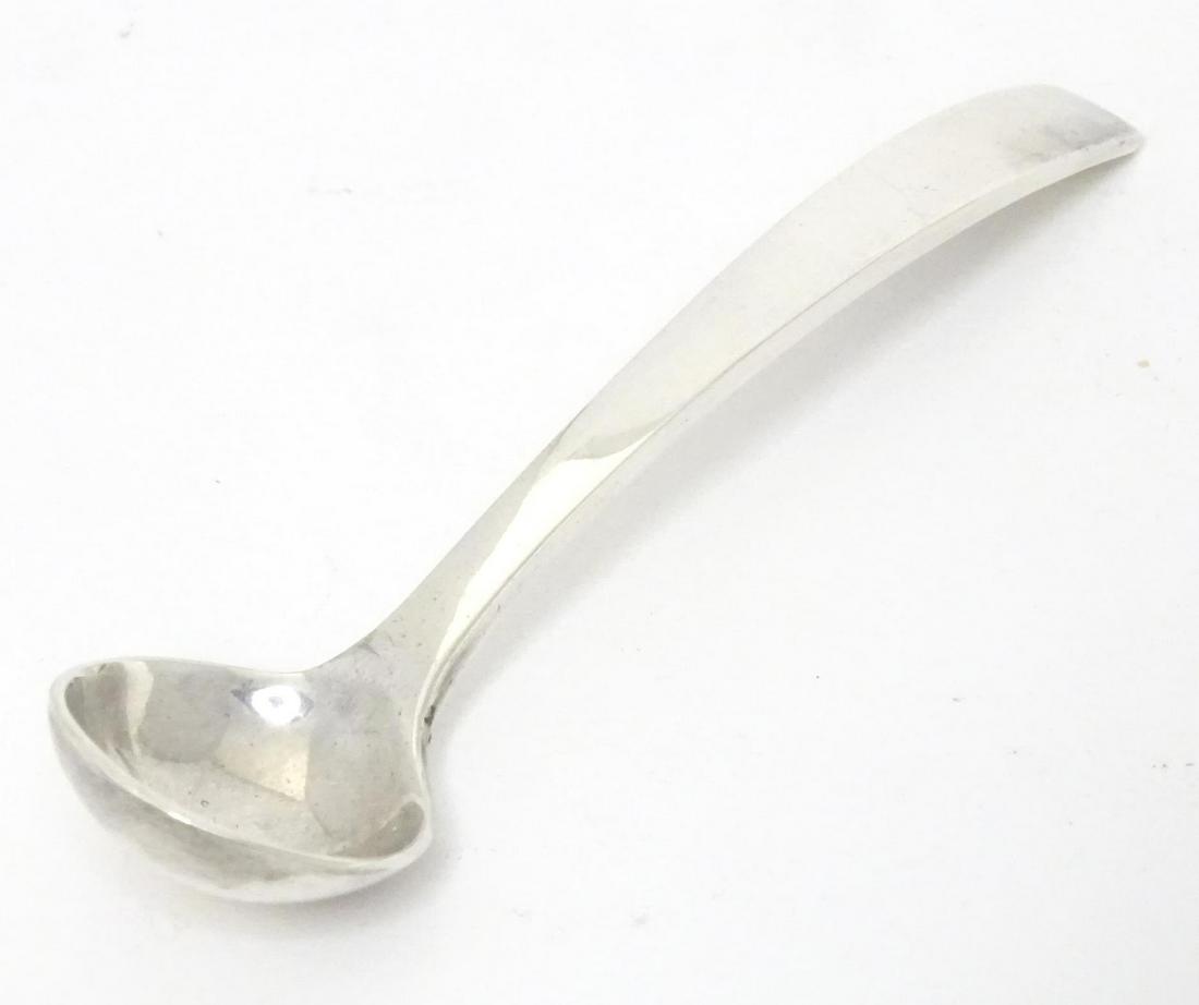 A Queen Elizabeth II silver salt spoon of ladle form, hallmarked London 1972, maker Gerald Benney.: A Queen Elizabeth II silver salt spoon of ladle form, hallmarked London 1972, maker Gerald Benney. Approx. 3 1/2" long Please Note - we do not make reference to the condition of lots within descriptio