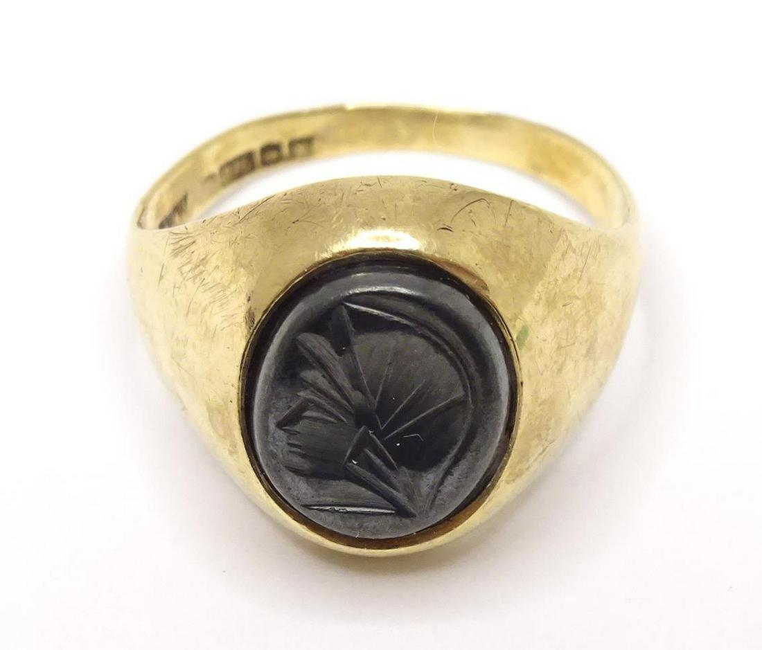 A 9ct gold ring set with intaglio. Ring size approx. O  Please Note - we do not make reference to (1 of 4)