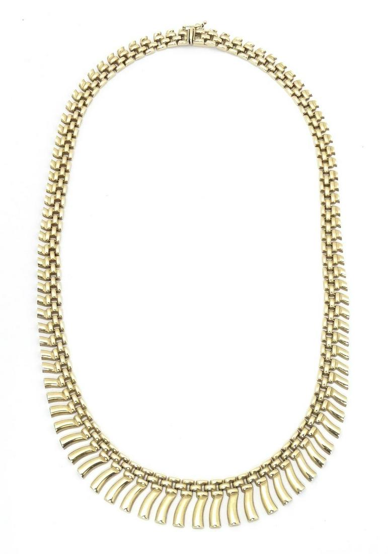 A 9ct gold necklace in the style of a Cleopatra collar. Approx 16" long Please Note - we do not: A 9ct gold necklace in the style of a Cleopatra collar. Approx 16" long Please Note - we do not make reference to the condition of lots within descriptions. We are however happy to provide additional