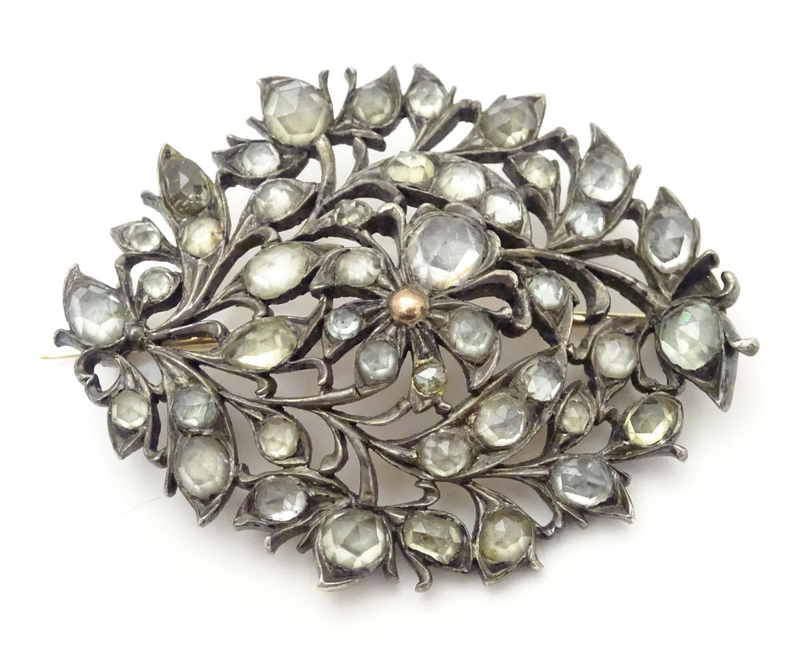 A 19thC Sri Lankan white metal brooch set with Matara style white stones. Approx 2" long  Please (1 of 3)