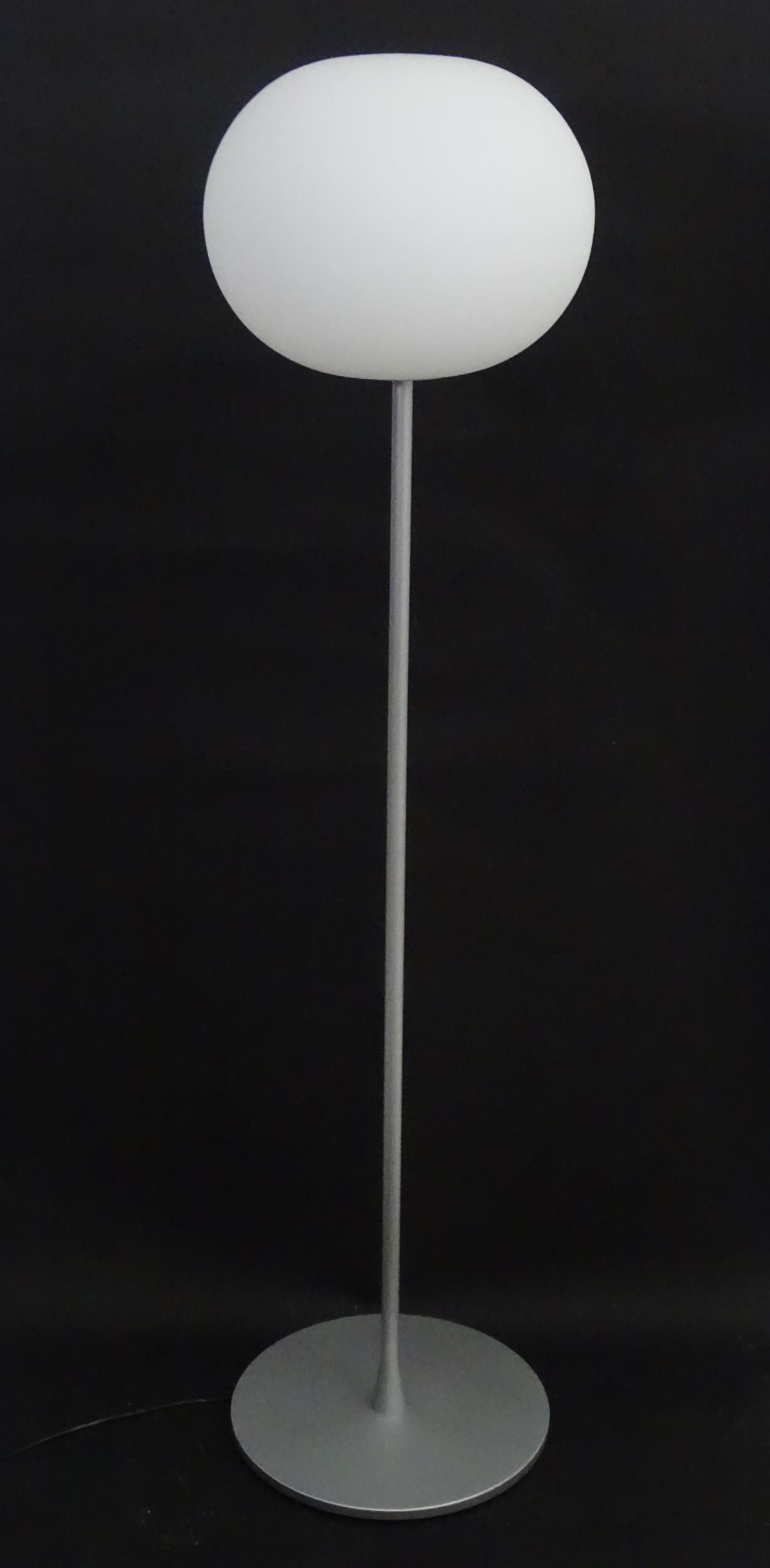 A Flos Glo-Ball standard / floor lamp with glass shade, designed by Jasper Morrison. Approx. 53": A Flos Glo-Ball standard / floor lamp with glass shade, designed by Jasper Morrison. Approx. 53" high Please Note - we do not make reference to the condition of lots within descriptions. We are howeve