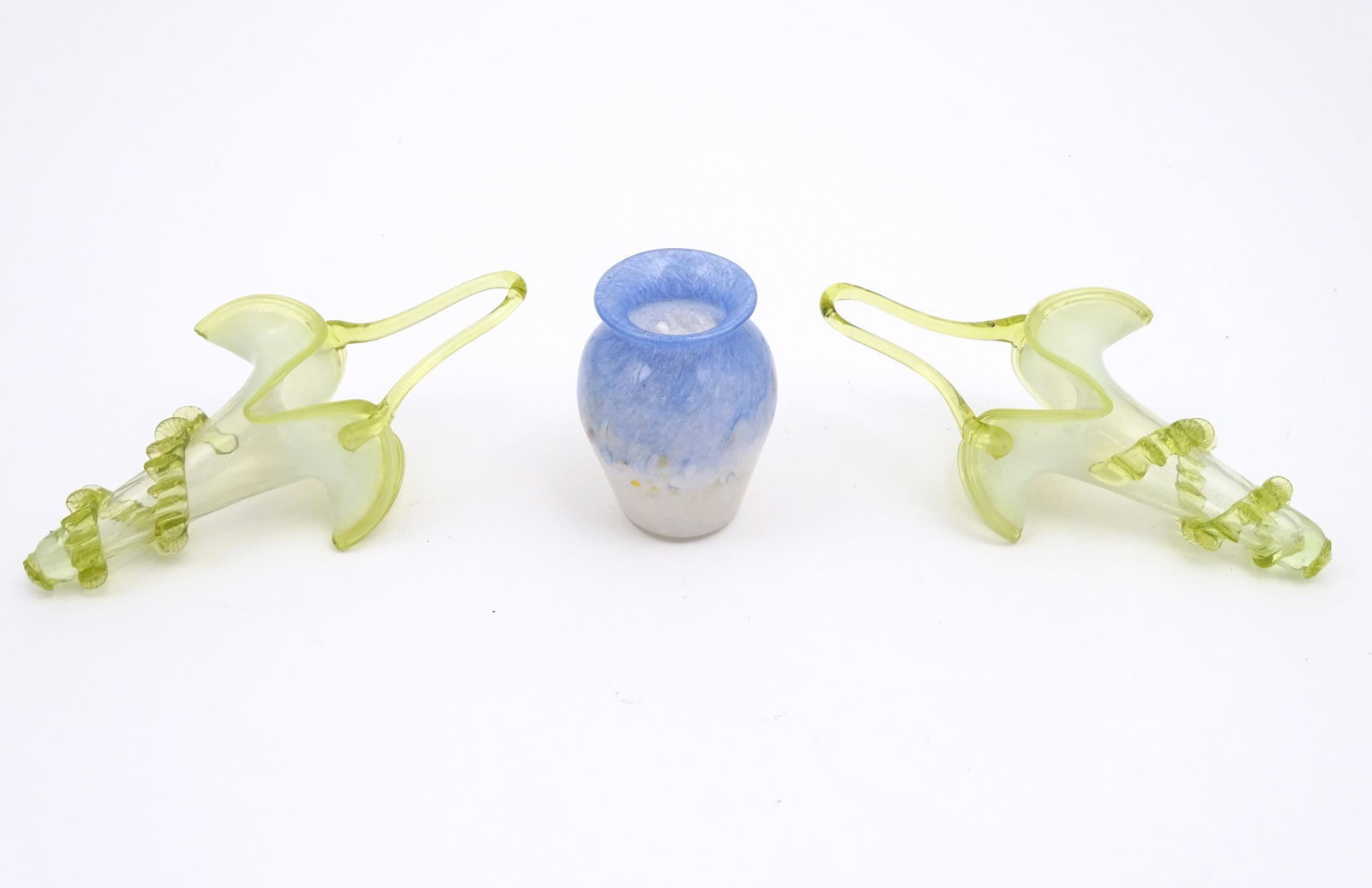 Two vaseline glass hanging epergne baskets together with an Art glass vase approx 4"high (3)Please: Two vaseline glass hanging epergne baskets together with an Art glass vase approx 4"high (3)Please Note - we do not make reference to the condition of lots within descriptions. We are however happy to