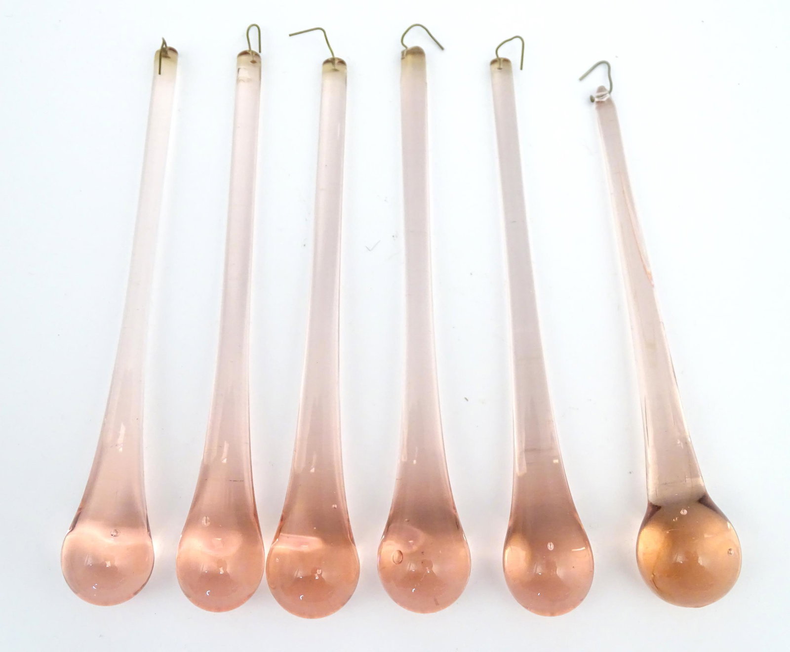 Six peach glass lustre drops Approx 6 1/2" long (6)Please Note - we do not make reference to the: Six peach glass lustre drops Approx 6 1/2" long (6)Please Note - we do not make reference to the condition of lots within descriptions. We are however happy to provide additional information regarding