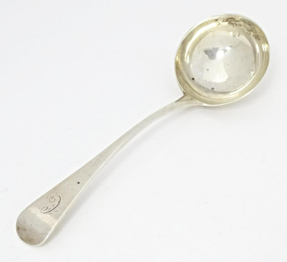 A Geo III silver sauce ladle hallmarked London 1799, maker Solomon & Hougham. Approx. 7 1/4" (1 of 7)