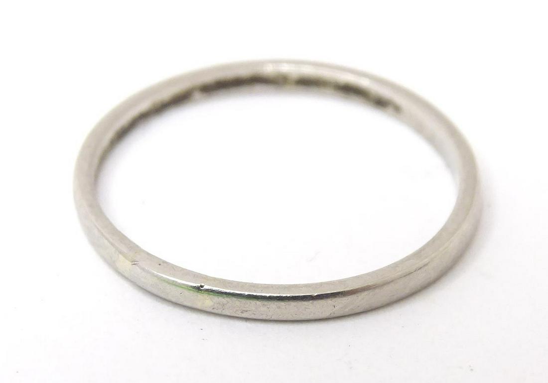 A platinum band. Ring size approx NPlease Note - we do not make reference to the condition of lots (1 of 3)