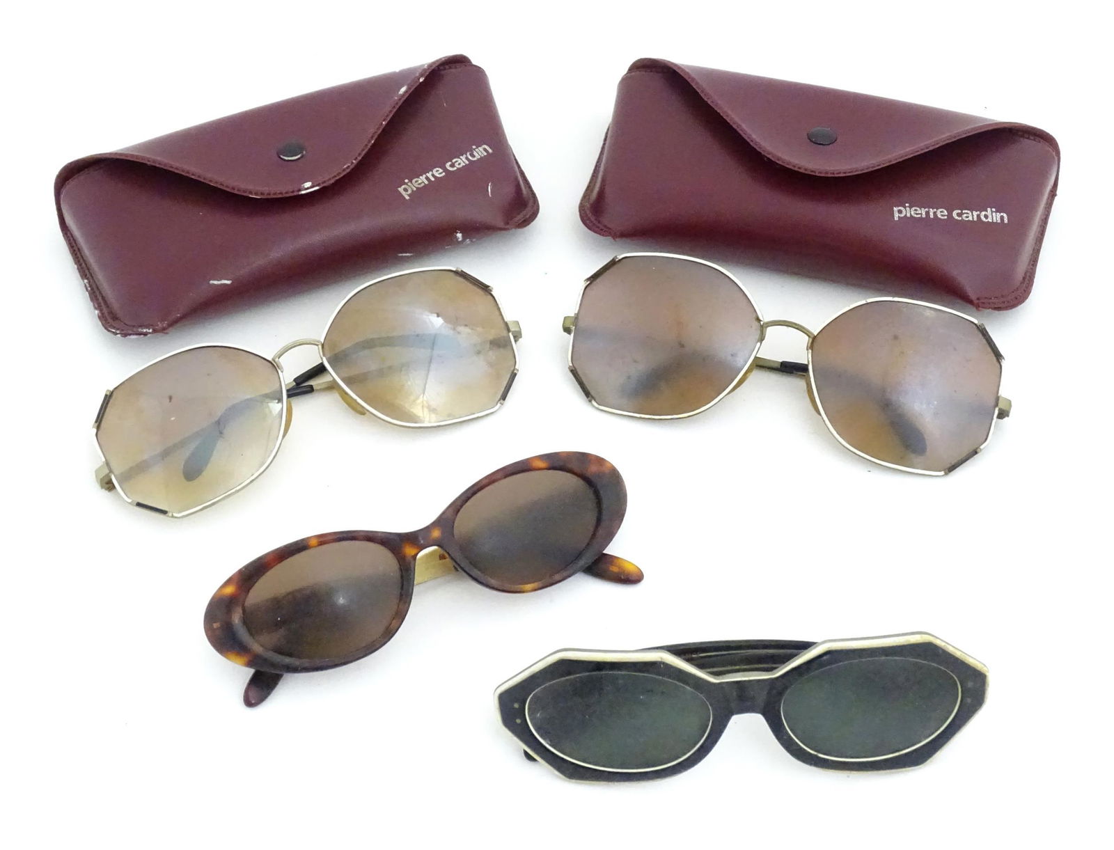 Vintage fashion / clothing: 4 pairs of sunglasses comprising a black and white pair of sunglasses: Vintage fashion / clothing: 4 pairs of sunglasses comprising a black and white pair of sunglasses marked 'Correna France' on the inside arm, a pair of tortoiseshell coloured Guess sunglasses and 2 pai