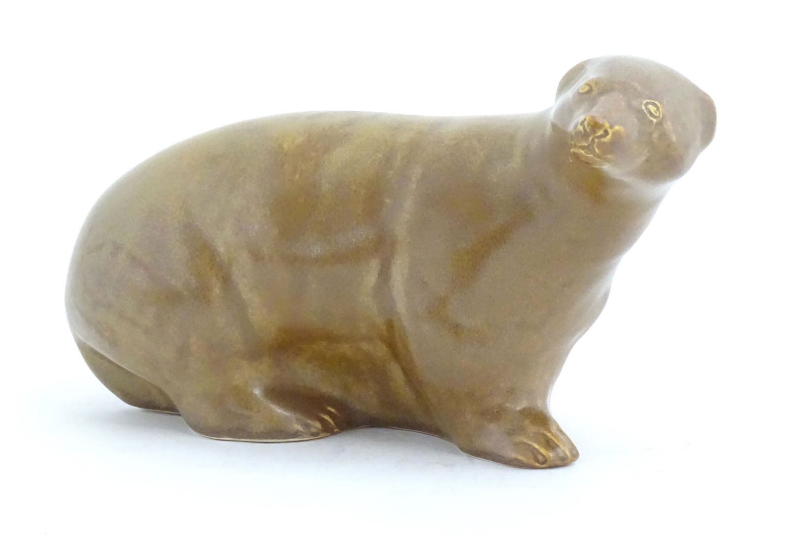 A ceramic model of a brown bear. Approx. 9" wide (1 of 4)