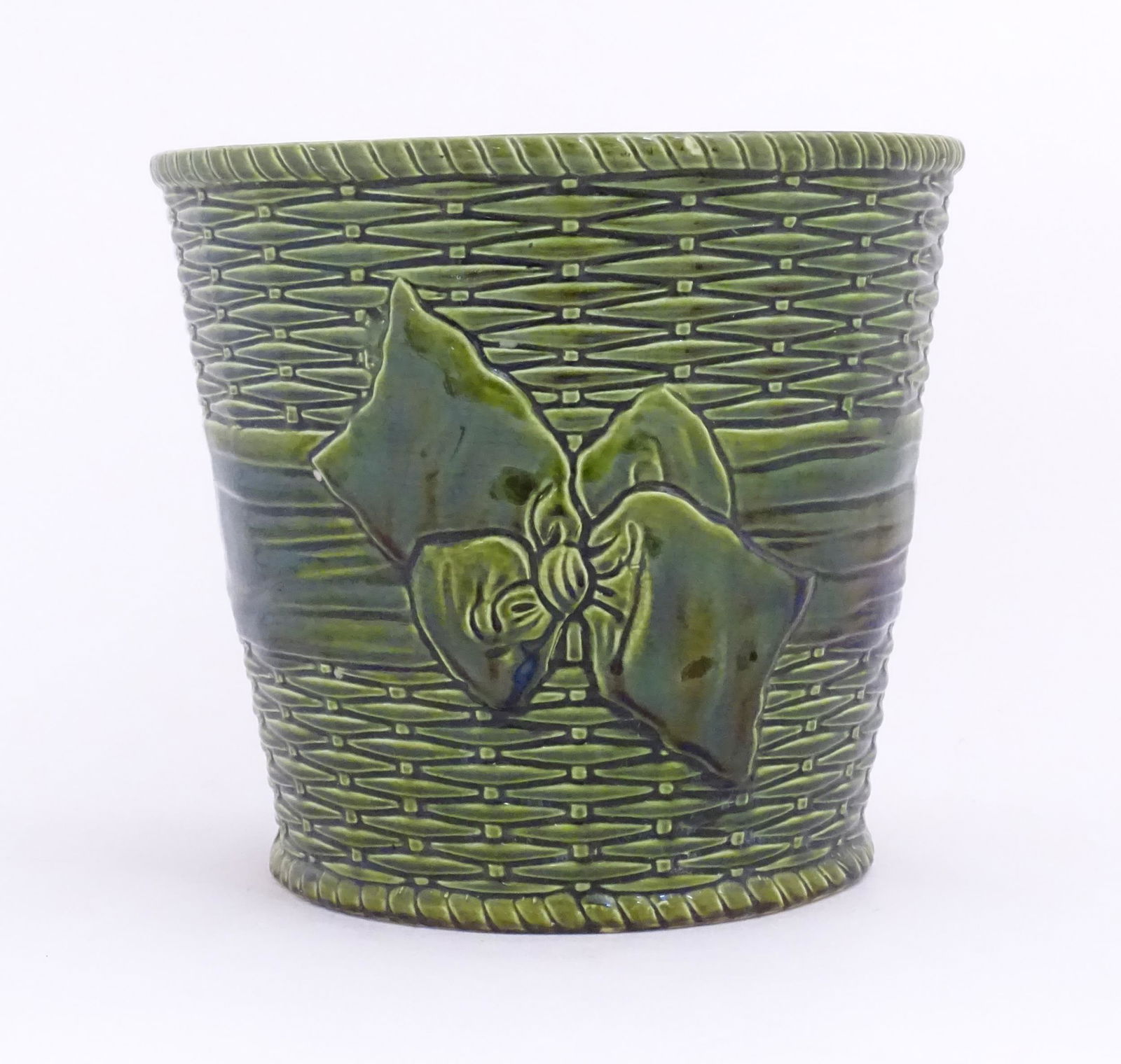 A Minton style majolica planter of tapering form with basket weave and ribbon decoration. Marked: A Minton style majolica planter of tapering form with basket weave and ribbon decoration. Marked under Foresters Ltd. Approx. 11" high